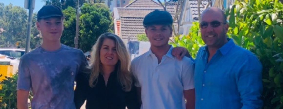 William smiling with his family